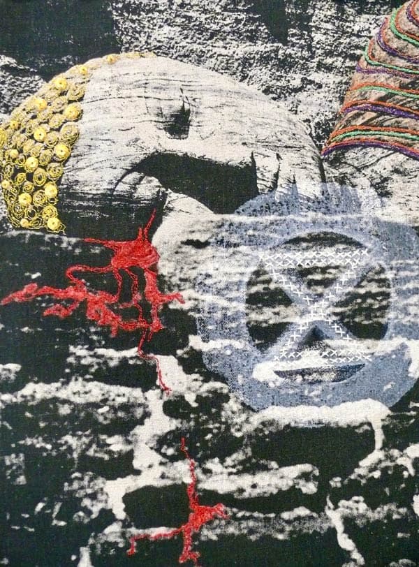 The work was primarily stitched using free motion machine embroidery using gold thread and metallic sequins for the headdress. The Buddha's silent tears of blood were stitched in red and enhanced with inktense pencils while the extinction emblem was overprinted with diluted acrylic paint and then hand embroidered.
